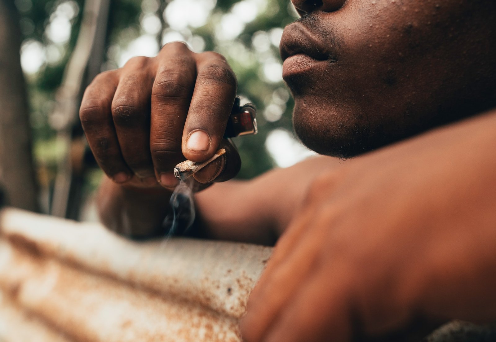 Jamaican man smoking joint