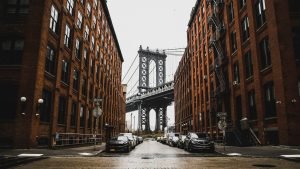 street in New York showing Brooklyn bridge