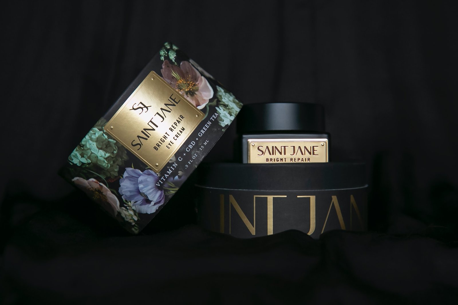 Saint Jane CBD eye cream on black background