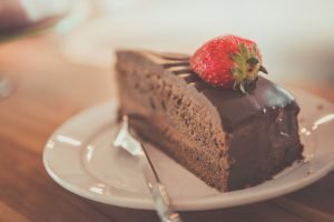slice of chocolate cake with strawberry on top