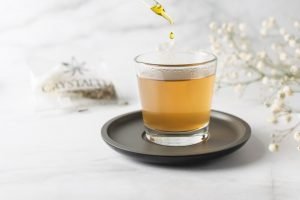 tea in a glass on white surface