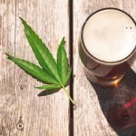 Cannabis,Beer,On,A,Picnic,Table,Wood,Surface,,Outside,On