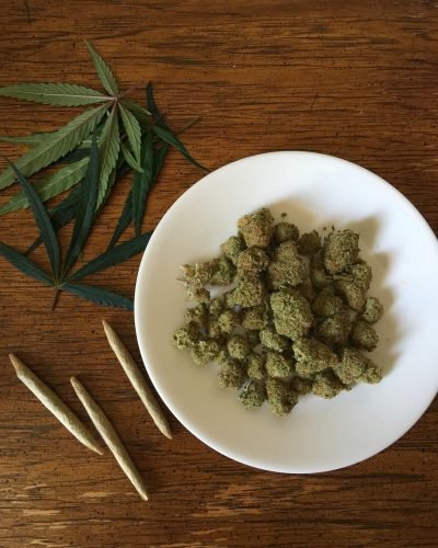 cannabis buds on white plate
